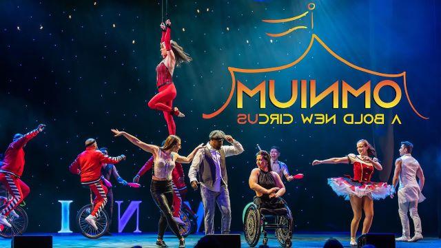 circus performers pose on stage with the words Omnium A Bold New Circus